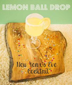 a wooden sign that says lemon ball drop new year's eve cocktail on it