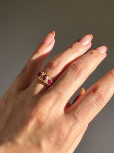 Antique 18k yellow gold ring from Birmingham, England c 1916 featuring three radiating rubies and accent old cut diamonds. Great antique condition Size: 5 resizable*Weight: 2.5 gramsBand: 8.0 mm (front), 2.2 mm (back)Rubies: 5.0 mm x 4.00 mm oval cut, 3.8 mmx 2 round cutsDiamonds: 1.8 mm x 4 old cut diamondsHallmarks: crown for gold, 18, anchor for Birmingham, "r" for 1916 Antique Ruby Ring, Ruby Diamond Ring, Ruby Diamond Rings, Birmingham England, Etsy Instagram, 18k Yellow Gold Ring, Ruby Diamond, Ruby Ring, Ring Size Guide