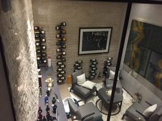 a living room filled with lots of bottles of wine