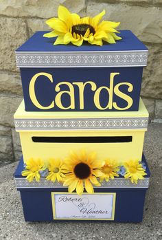 a blue and yellow card box with sunflowers on the top that says cards