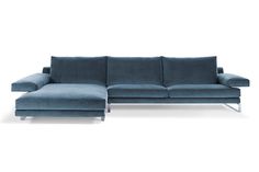 a blue couch and ottoman sitting next to each other