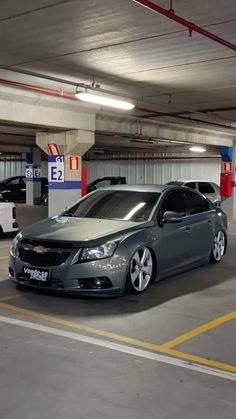 two cars are parked in a parking garage