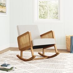 a rocking chair sitting on top of a wooden floor