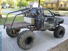 an off road vehicle is parked on the sidewalk