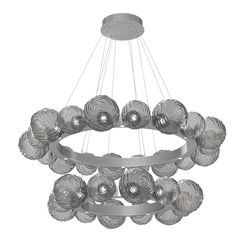 a modern chandelier with glass balls hanging from the ceiling