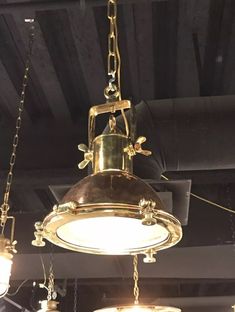 an old fashioned light fixture hanging from the ceiling