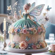 a cake decorated with flowers and a fairy figurine sitting on top of it