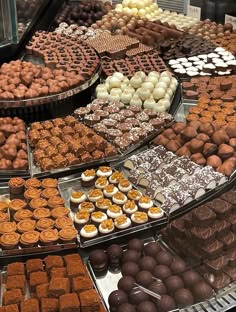 a display case filled with lots of different types of desserts