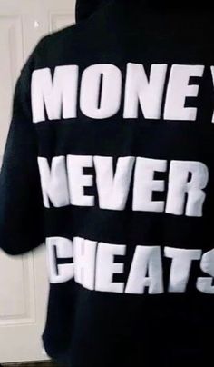 the back of a person's shirt that says money never sweats