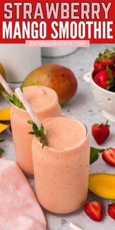 strawberry mango smoothie in two glasses with strawberries on the side