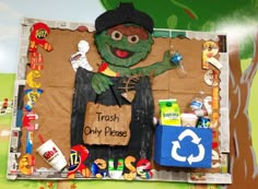 a cardboard cutout of a person holding a trash bag with the words trash only please on it