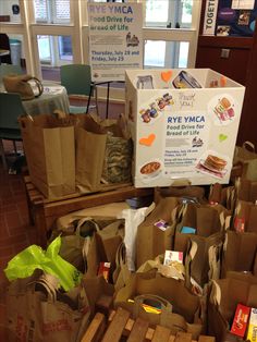 many brown bags are stacked on top of each other