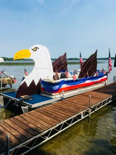 an eagle shaped boat is docked at the dock