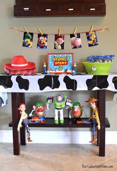 toy story birthday party decorations on a table