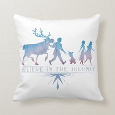 a white pillow with the silhouettes of people and animals on it that says believe in the journey