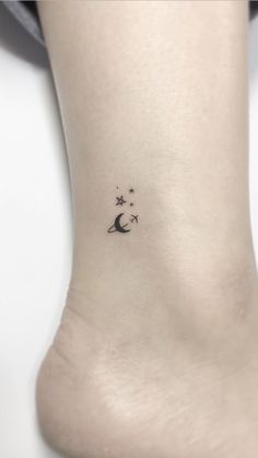 small moon and stars tattoo on the ankle