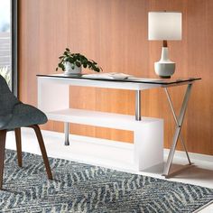 a chair and table in a room with wood paneling on the wall behind it