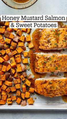 salmon and sweet potatoes on a baking sheet