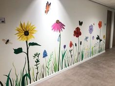 an office hallway painted with flowers and butterflies