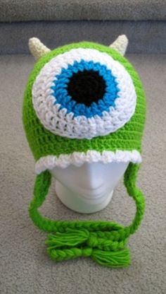 a crocheted hat with an eyeball on it