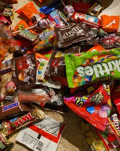 a pile of assorted candy on the ground