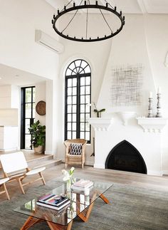 a living room filled with furniture and a fire place