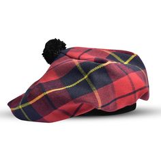 a red and blue plaid hat with a black pom - pom on top