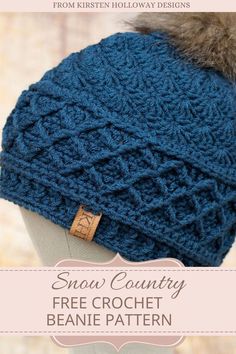 a knitted hat with a fur pom on top and text that reads, snow country free crochet beanie pattern