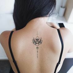 a woman with a tattoo on her back