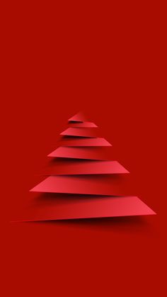 a red paper christmas tree on a red background