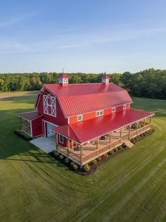 an aerial view of a large red barn