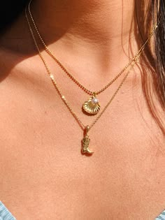 "The ultimate gift necklace for the Coastal or Western cowgirl. 2mm Gold Filled beaded necklace or Cable chain with your choice of a cowgirl boot or seashell charm necklace. Want both charms combined? Select Option 3 at checkout. Material: 18 Karat Gold Filled, Hypoallergenic. Tarnish Resistant. Gold-filled does not de-laminate or peel like Gold plated Jewelry nor does it tarnish as readily as silver. Generally speaking, gold filled is better quality and will have a much longer lasting color tha Coastal Necklaces, Western Necklaces Cowgirl Fashion, Coastal Cowgirl Gifts, Cowboy Boot Jewelry, Cowgirl Necklace, Jewelry Western, Cowboy Boot Necklace, Coastal Cowgirl Jewelry, Coastal Cowgirl Hat