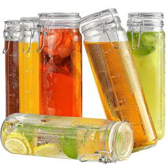 four jars filled with different types of drinks