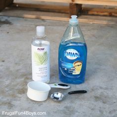 the contents of a dishwasher sitting next to a bottle of water and measuring spoon