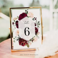 a table number with flowers on it