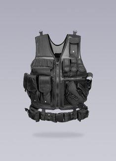 Enhance your performance during outdoor activities with this fake bulletproof armor suit. Unleash the warrior within you with our Bulletproof Military Vest, a testament to the modern urban male's fierce strength and unyielding resilience. This sartorial marvel is not just a piece of clothing; it is an embodiment of power and control, a tribute to those who dare to navigate the urban landscape with audacity and finesse. Crafted with a keen eye for aesthetics and utility, this black faux bulletproof vest seamlessly transitions from a high-stakes paintball match to a demanding urban exploration. Enriched with a plethora of features and materials - velcro, straps, buckles, cargo pockets, mesh and an integrated front belt - this combat tactical vest exudes an air of unmatched functionality. It' Bulletproof Armor, Bulletproof Clothing, Army Vest, Urban Warrior, Bulletproof Vest, Urban Male, Armor Suit, Apocalyptic Clothing, Military Vest