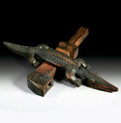 an old wooden toy airplane sitting on top of a table