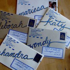 five envelopes with handwritten letters on them are sitting on a table next to each other