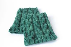 the green knitted scarf is folded up