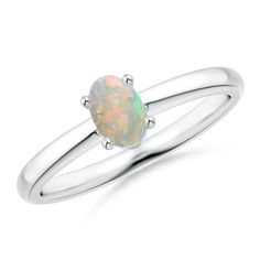 a white gold ring with an opal stone