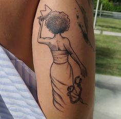 a woman's arm with a black and white drawing of a dress on it