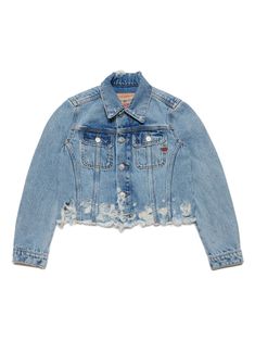 a denim jacket with holes on the back