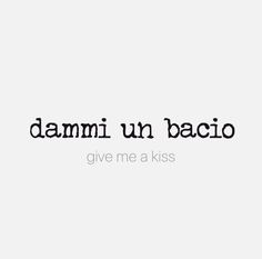 the words damn un bacio give me a kiss written in black on a white background