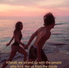 two people are running on the beach with an ocean in the background that says, after all we end up with the people who look like us from the inside