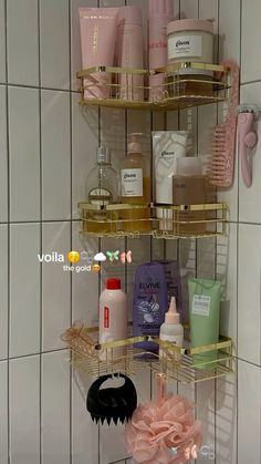 a bathroom shelf filled with personal care items next to a shower head and hand sanitizer