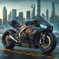 a black motorcycle parked in front of a city