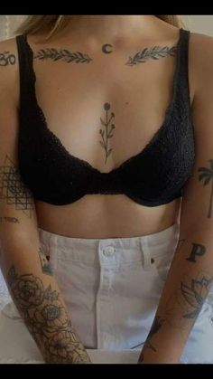 a woman with many tattoos on her chest