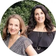 two women standing next to each other smiling