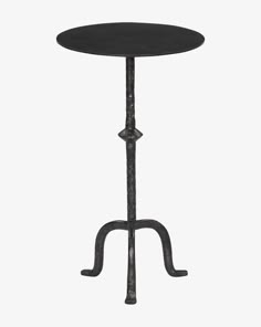 an iron table with a black top on a white background, it is isolated from the side