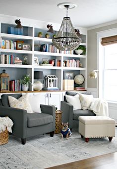 a living room filled with furniture and bookshelves